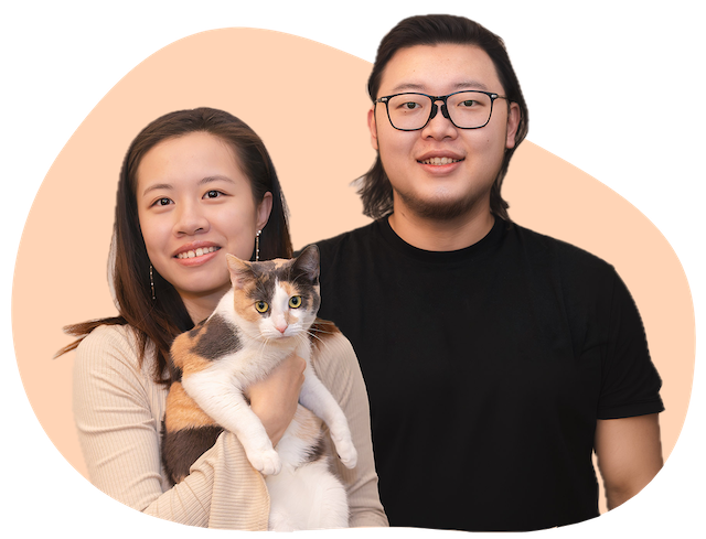 A young Chinese male and female. Female holding a calico race cat 